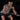 Man exercising with xpeed hybrid weight lifting gloves whilse doing a sled pull 